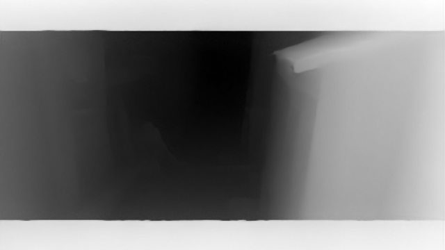 Grayscale depth estimate with nearby walls lighter than the distant alley